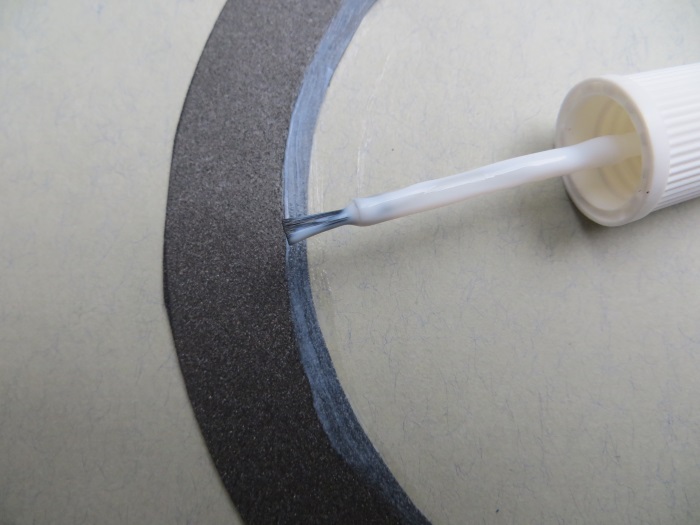 Repairing with a flat foam surround - apply glue to the inner lip of your flat speaker surround