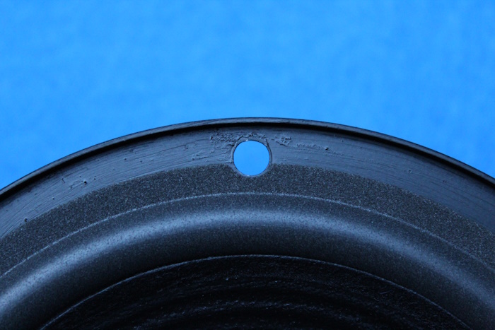 Foam surround with cut circular recess for the screw