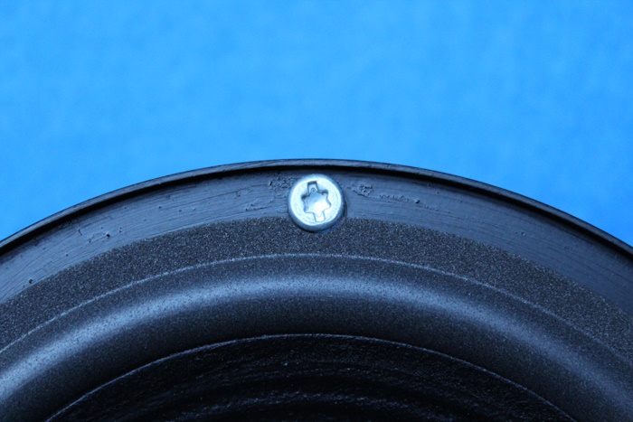 Foam surround with cut circular recess for the screw, the screw cannot damage the foam surround